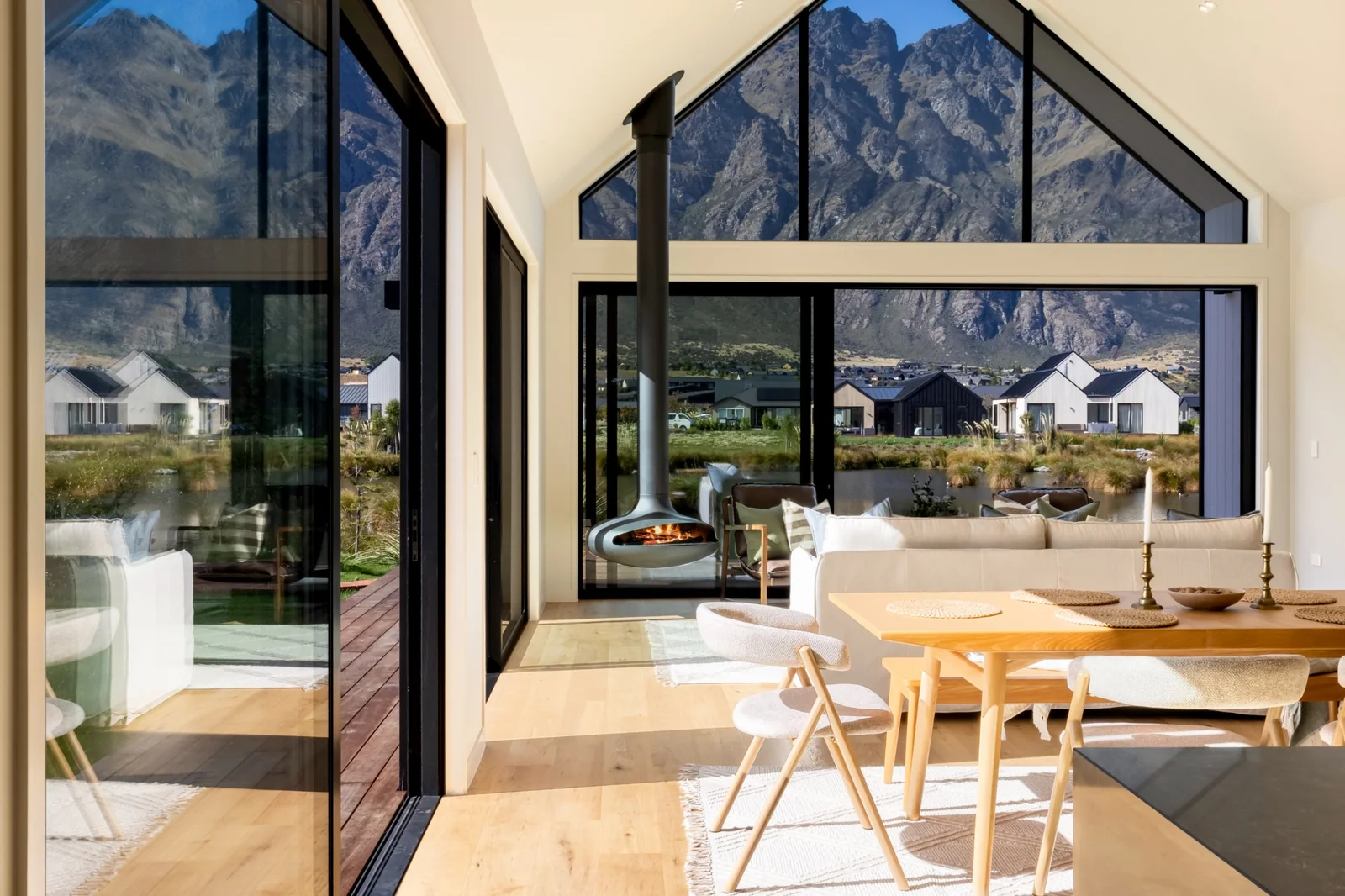 Living and dining room at 7 Centurion with floor-to-ceiling views of The Remarkables