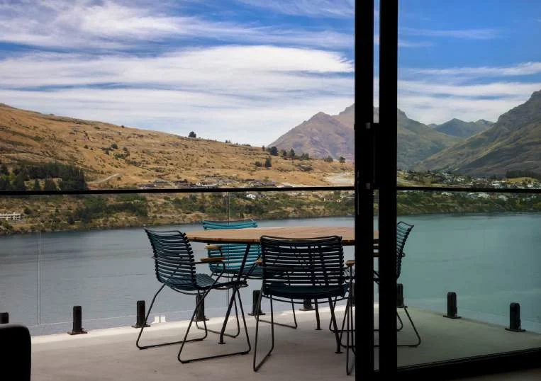 Balcony dining with a view across Lake Wakatipu